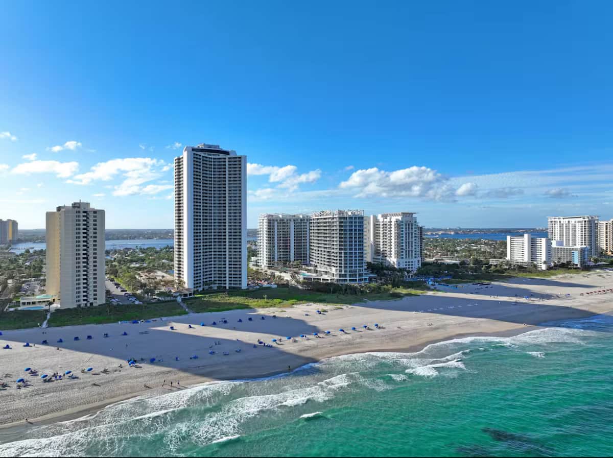 Aerial view of Singer Island, the resort buildings standing on the sand between the ocean and the Intracoastal