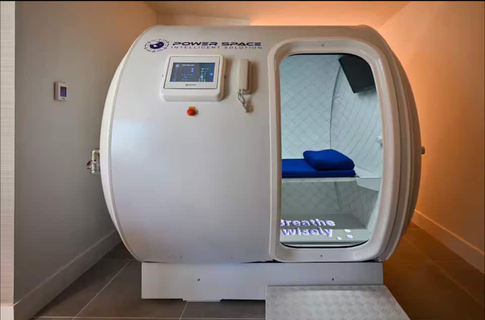 A hyperbaric oxygen therapy chamber in a treatment suite